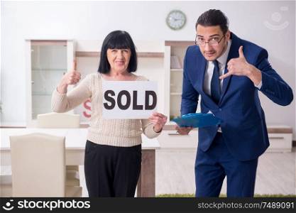 The male real estate agent and female client in the apartment. Male real estate agent and female client in the apartment
