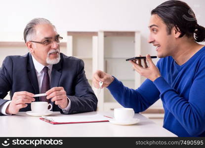 The male real estate agent and male client in the apartment. Male real estate agent and male client in the apartment
