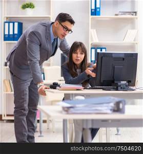 The man and woman working in the office. Man and woman working in the office