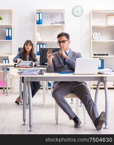 The man and woman working in the office. Man and woman working in the office