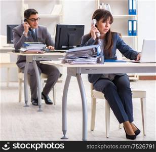 The man and woman working in the office. Man and woman working in the office