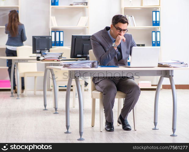 The man and woman working in the office. Man and woman working in the office