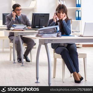 The man and woman working in the office. Man and woman working in the office