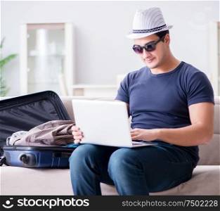The man booking online his travel flight and hotel. Man booking online his travel flight and hotel