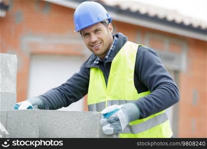 the man-builder works with concrete