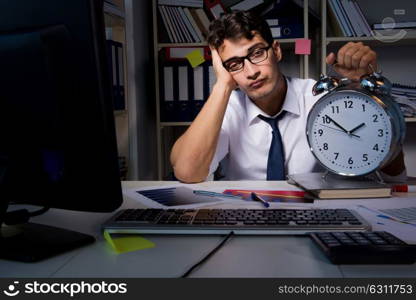 The man businessman working late hours in the office. Man businessman working late hours in the office