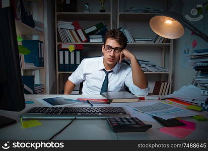 The man businessman working late hours in the office. Man businessman working late hours in the office