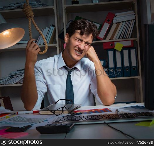 The man businessman working late hours in the office. Man businessman working late hours in the office
