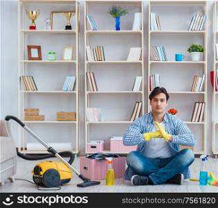 The man doing cleaning at home. Man doing cleaning at home