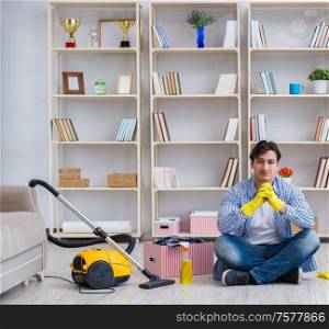 The man doing cleaning at home. Man doing cleaning at home