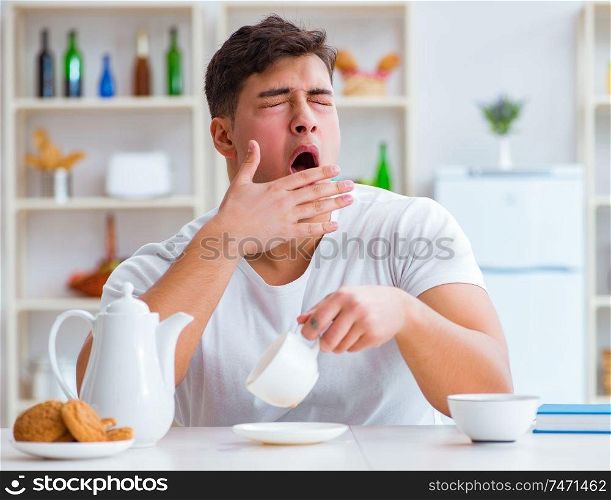 The man falling asleep during his breakfast after overtime work. Man falling asleep during his breakfast after overtime work
