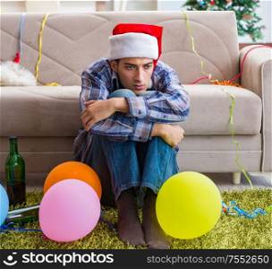 The man having hangover after christmas party. Man having hangover after christmas party