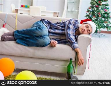 The man having hangover after christmas party. Man having hangover after christmas party