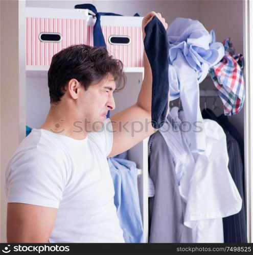 The man helpless with dirty clothing after separating from wife. Man helpless with dirty clothing after separating from wife