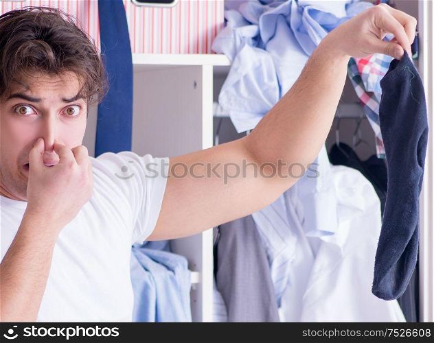The man helpless with dirty clothing after separating from wife. Man helpless with dirty clothing after separating from wife