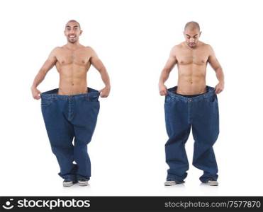 The man in dieting concept with oversized jeans. Man in dieting concept with oversized jeans