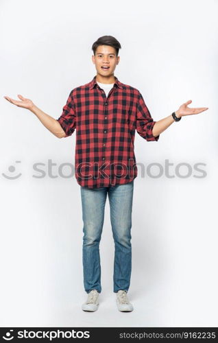 The man in the black shirt and the hand sign opened to both sides.