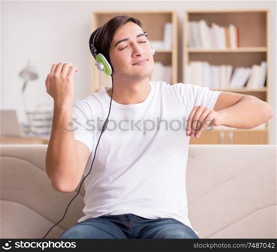The man listening to music at home. Man listening to music at home