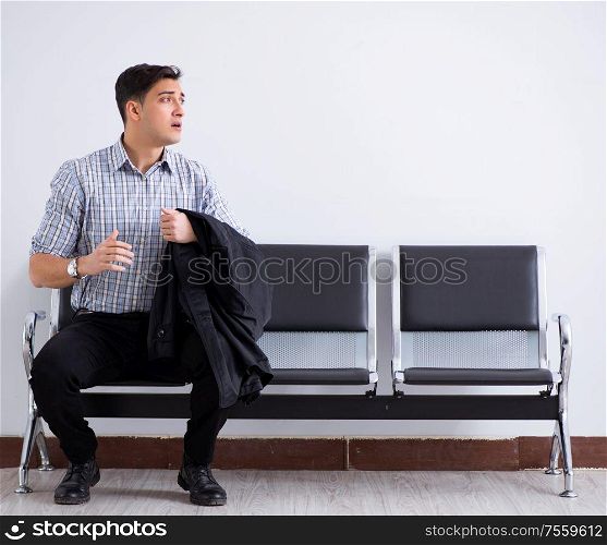 The man nervously impatiently waiting in the lobby. Man nervously impatiently waiting in the lobby