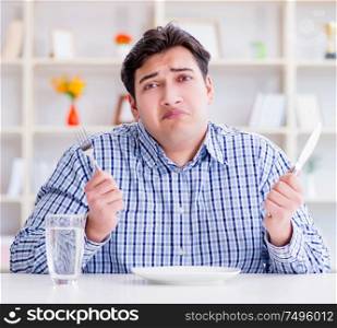 The man on diet waiting for food in restaurant. Man on diet waiting for food in restaurant