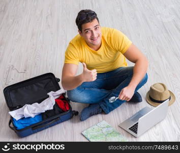 The man planning his vacation trip with map. Man planning his vacation trip with map