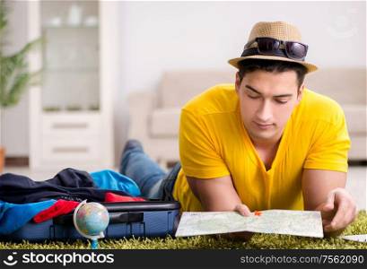 The man planning his vacation trip with map. Man planning his vacation trip with map