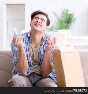 The man receiving wrong parcel with glasses. Man receiving wrong parcel with glasses