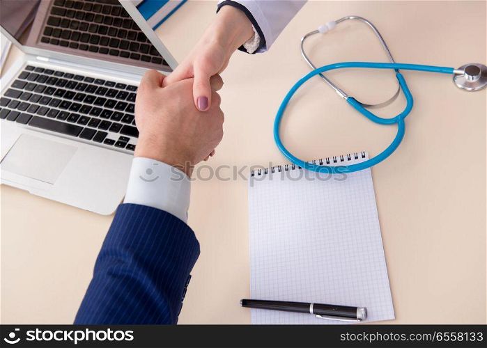 The man signing medical insurance contract. Man signing medical insurance contract