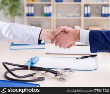 The man signing medical insurance contract. Man signing medical insurance contract