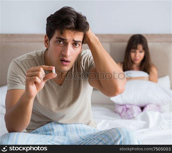 The man suffering from impotency with pill. Man suffering from impotency with pill
