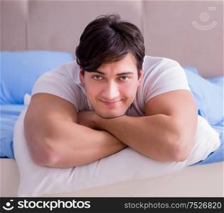 The man suffering from insomnia lying in bed. Man suffering from insomnia lying in bed
