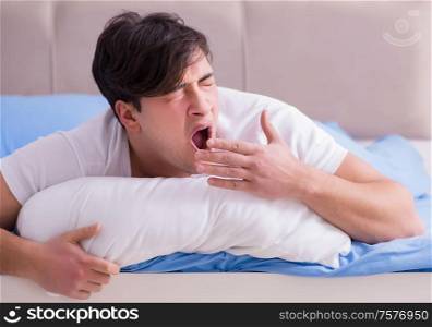 The man suffering from insomnia lying in bed. Man suffering from insomnia lying in bed