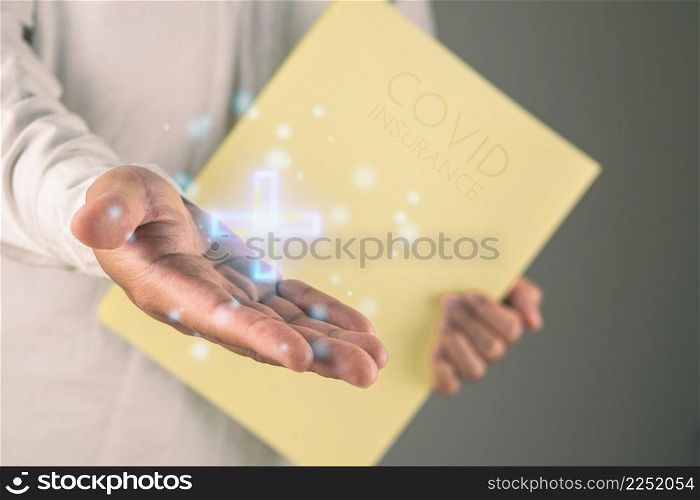 The man that holds agreement document presents about covid insurance. Health care and save money. This shot was focus on the hand. Medium close up shot.