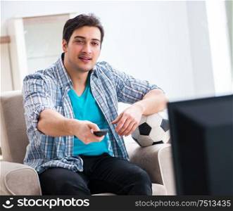 The man watching tv at home. Man watching tv at home