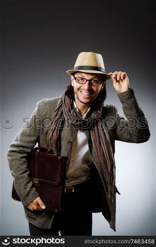 The man wearing vintage hat in funny concept. Man wearing vintage hat in funny concept