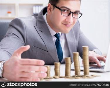 The man with coins in the office. Man with coins in the office