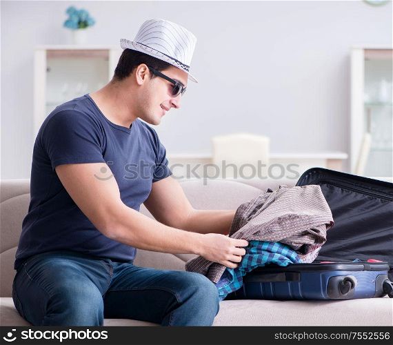 The man with hat preparing for summer vacation. Man with hat preparing for summer vacation