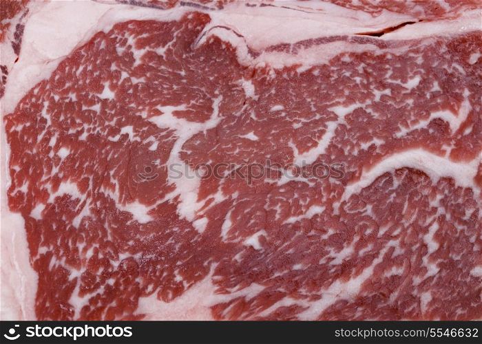 The marbling of a wagyu ribeye steak. The distribution of low-cholesterol, low-melting point fat throughout the meat gives wagyu its distinctive look and gourmet flavour, making it the most expensive kind of beef.