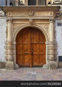 The massive portal of the medieval Deanery in the Old Town in the city of Krakow in Poland.