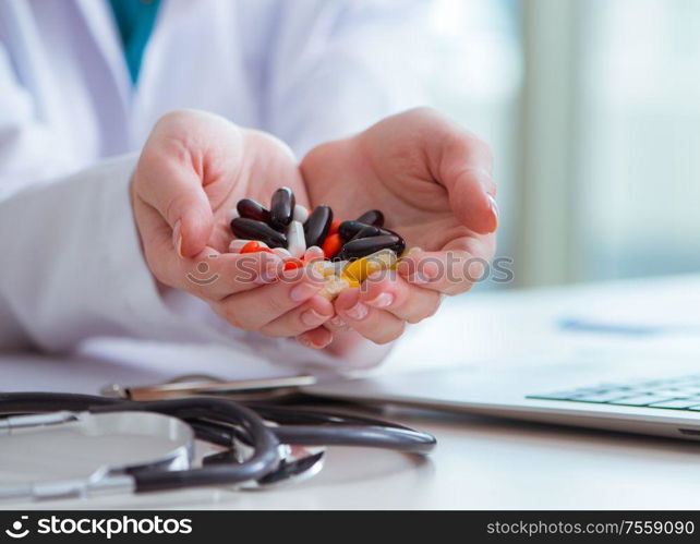 The medical concept with medicines and laptop computer. Medical concept with medicines and laptop computer