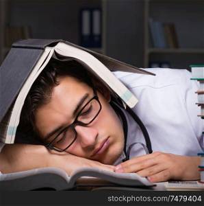 The medical student preparing for university exams at night. Medical student preparing for university exams at night