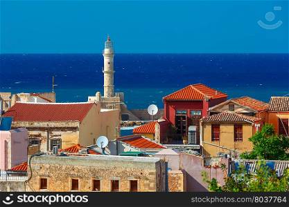 The medieval city with lighthouse in old harbour, aerial view from Schiavo Bastion in the sunny morning, Crete, Greece