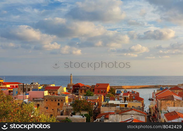 The medieval city with lighthouse in old harbour, aerial view from Schiavo Bastion in the evening, Crete, Greece