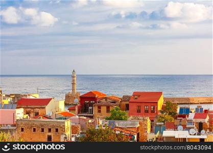 The medieval city with lighthouse in old harbour, aerial view from Schiavo Bastion in the sunny evening, Crete, Greece