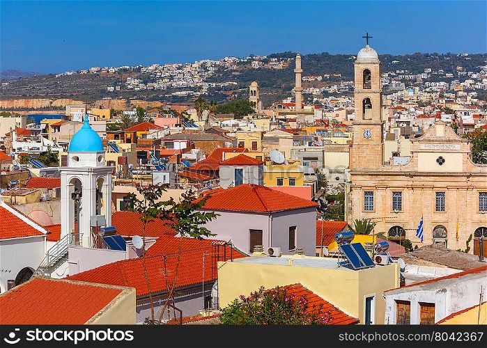 The medieval city with Orthodox cathedral Trimartiry, aerial view from Schiavo Bastion in the sunny morning, Crete, Greece