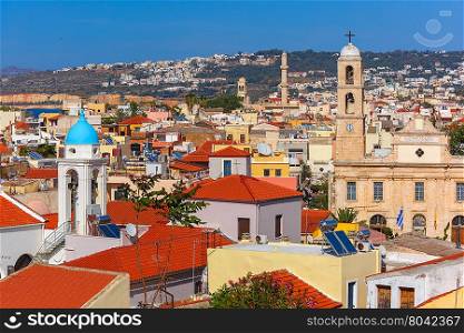 The medieval city with Orthodox cathedral Trimartiry, aerial view from Schiavo Bastion in the sunny morning, Crete, Greece