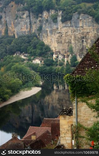 The medieval village of La Roque Gageac reflecting in Dordogne river