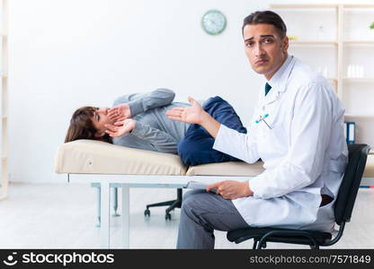 The mentally ill woman patient during doctor visit. Mentally ill woman patient during doctor visit