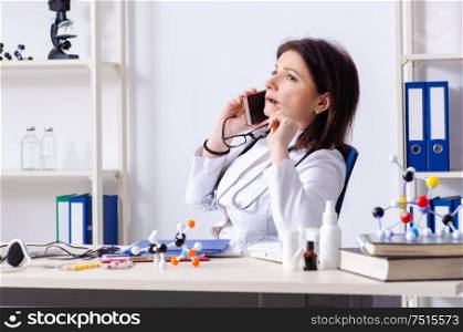 The middle-aged female doctor in telemedicine concept. Middle-aged female doctor in telemedicine concept