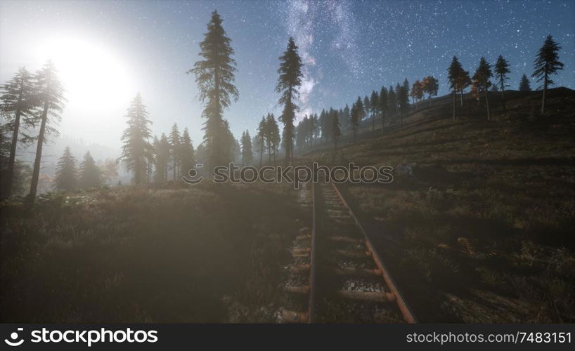 The milky way above the railway and forest